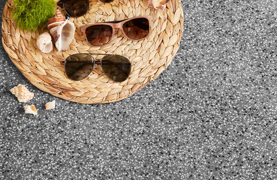 411 Grafite Terrazzo Matrix solid surface gray countertops with retail display of sunglasses 