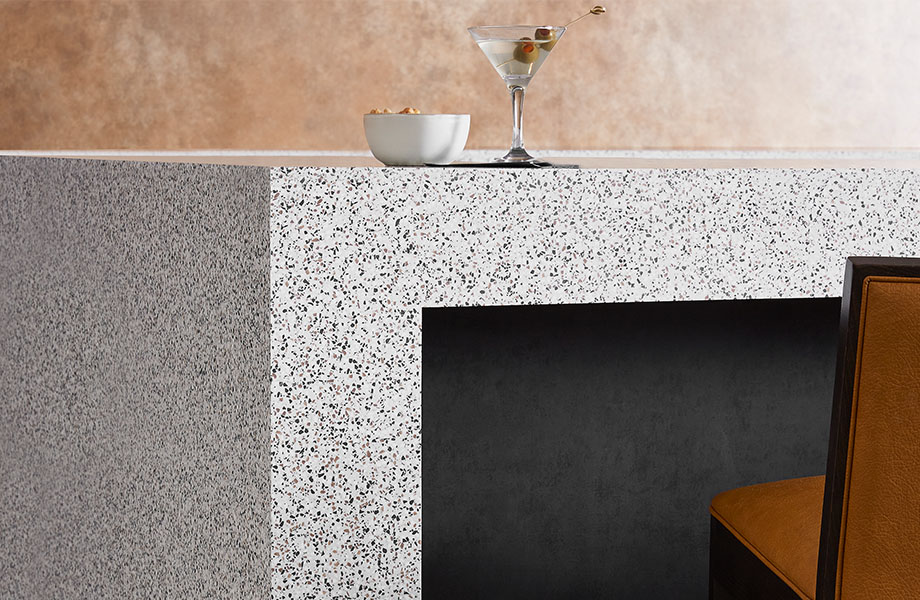 412 Dalmata Terrazzo Matrix table with drink and M9422 Black Patina solid metal beneath