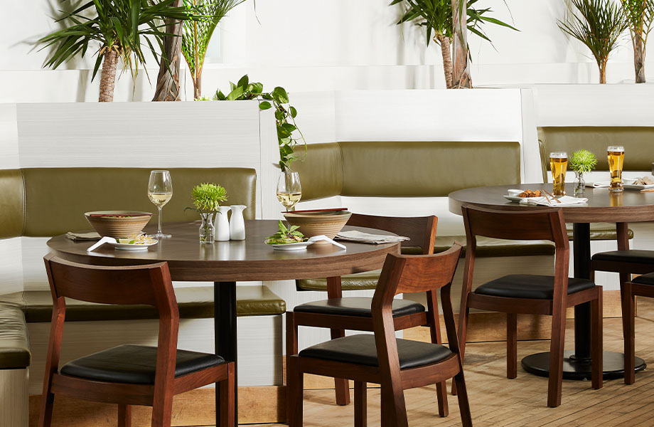 Restaurant with 5784-NG Ashwood Bone booths and 5789-43 Clove Spice Cherry tables