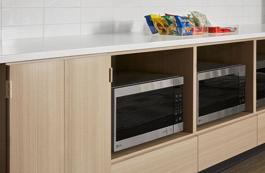 5785-NG Ashwood Beige cabinet with microwaves and 413 Tumbled Glass countertop