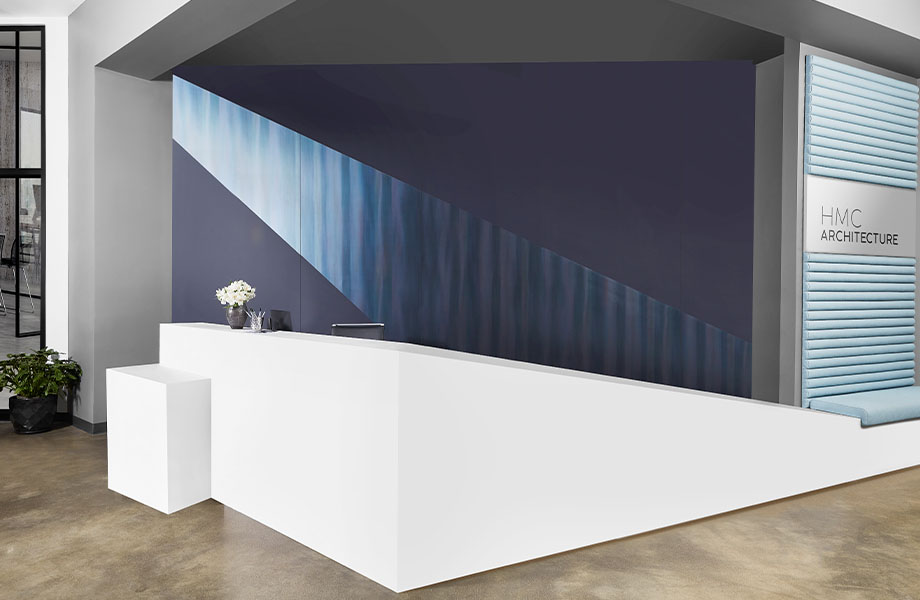 408 Luna Brite White reception desk with M9421 Dark Rolled Steel and 5323-AN Nocturne wall